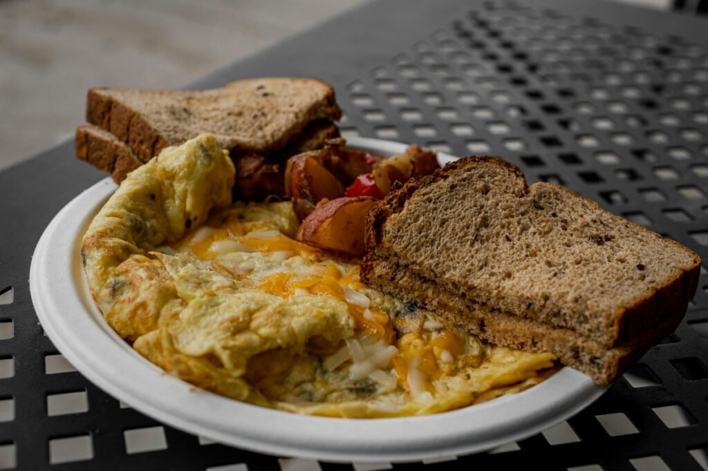 A savory vegan breakfast with tofu scramble, roasted potatoes, and toast on a plate