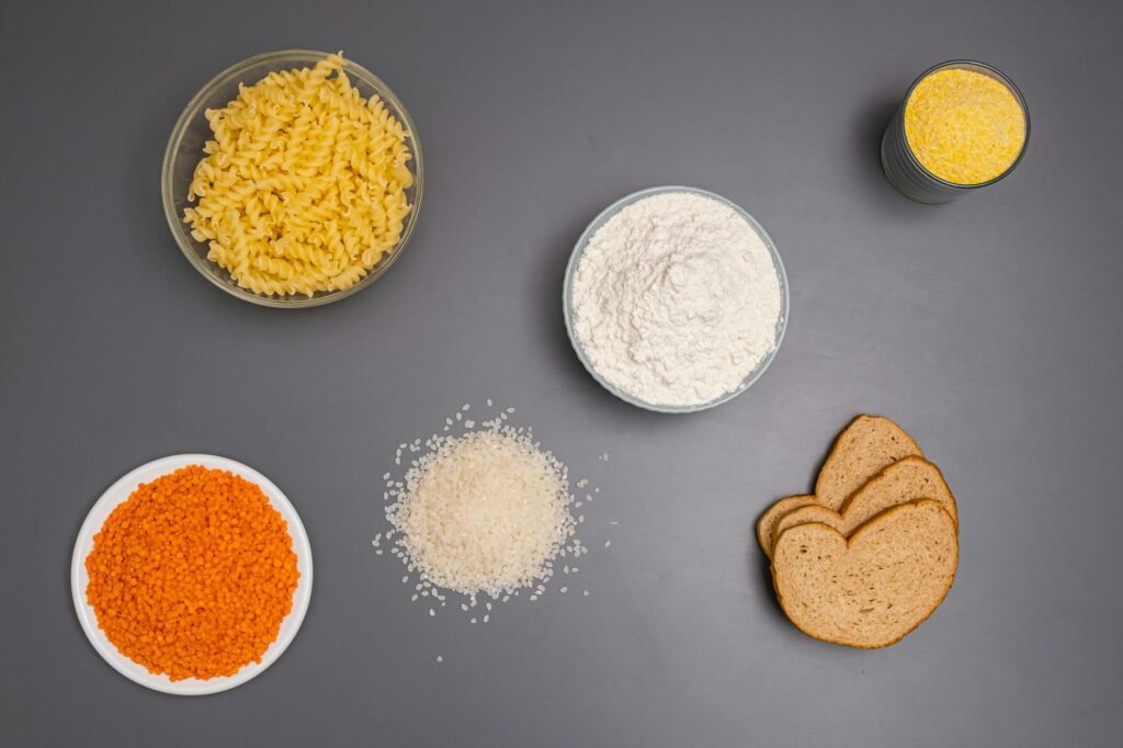 A grocery receipt, calculator, and low-cost plant-based meal prep ingredients on a kitchen table