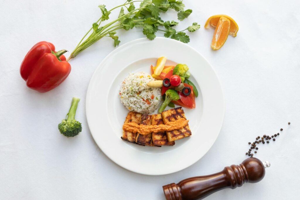 A simple tofu, rice, and roasted vegetable dinner on a weeknight table