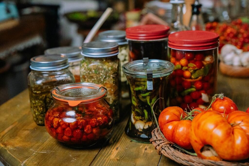 Pantry staples including tomato paste, vinegar, soy sauce, dried mushrooms, and chili flakes