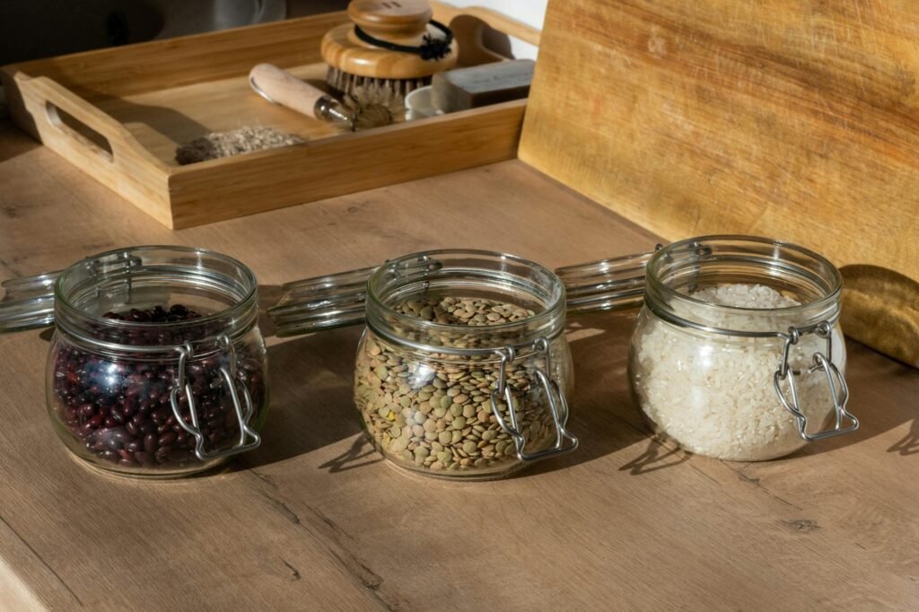 Affordable vegan staples arranged on a kitchen counter for meal planning