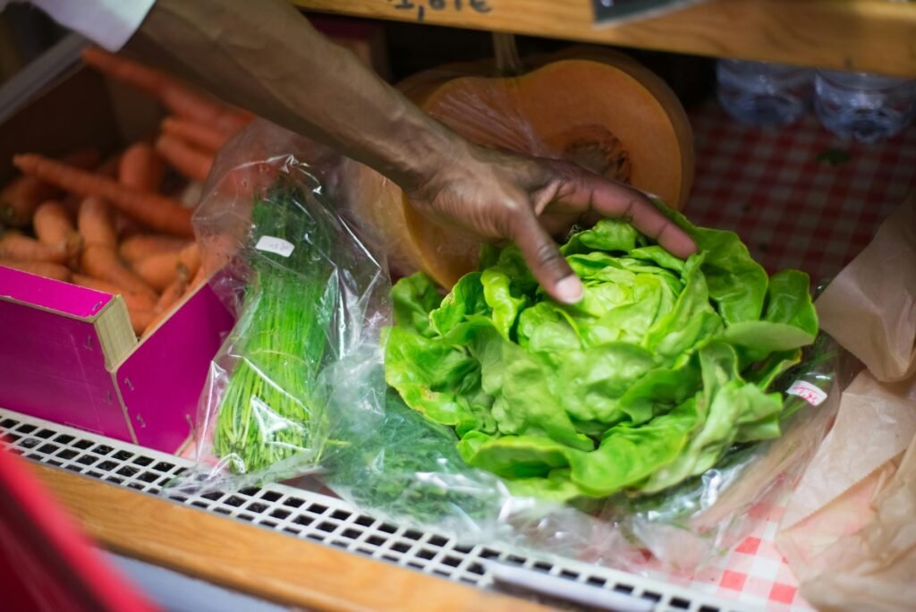 A shopper compares a Nutrition Facts label on a vegan packaged food