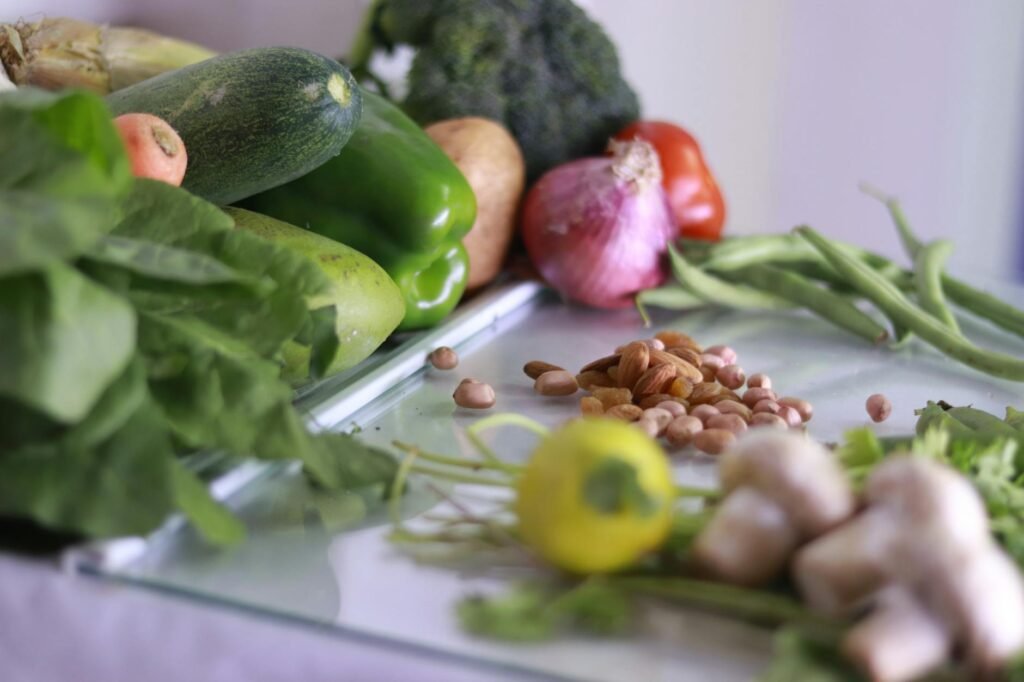 Canned beans, rice, vegetables, and a grocery receipt laid out on a table